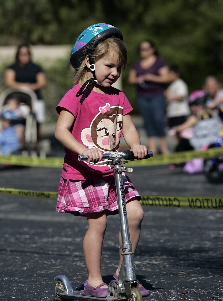 Four-year-old Savannah Sutherland decided to ride her scooter.