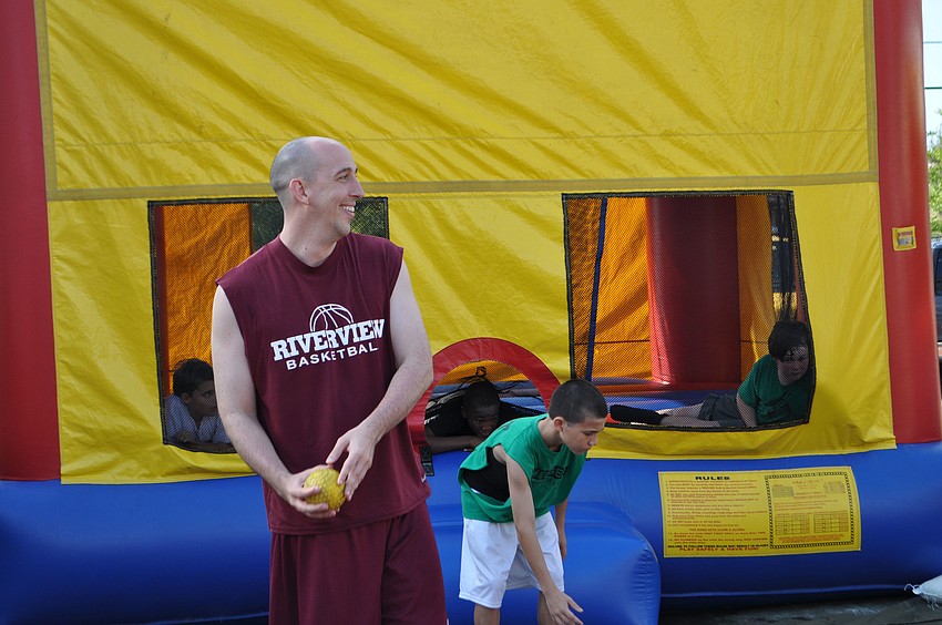 B.J. Ivey, basketball coach for Riverview High School and The View, gets ready to try his hand at the dunk tank.