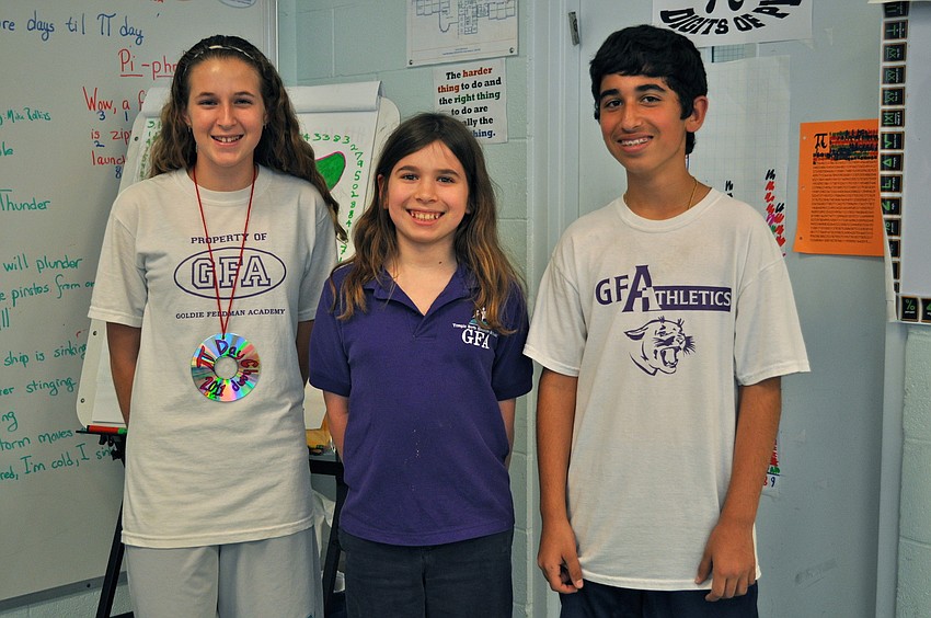 Sierra Van Such, pictured with Mo Glickman and Kosta Malliaras, was named the official contest winner after reciting an astounding 1,266 digits from memory.