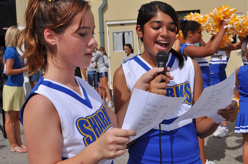 Cheerleaders Tiffany Butz and Jaysha Patel introduced several of the sports team members by name.