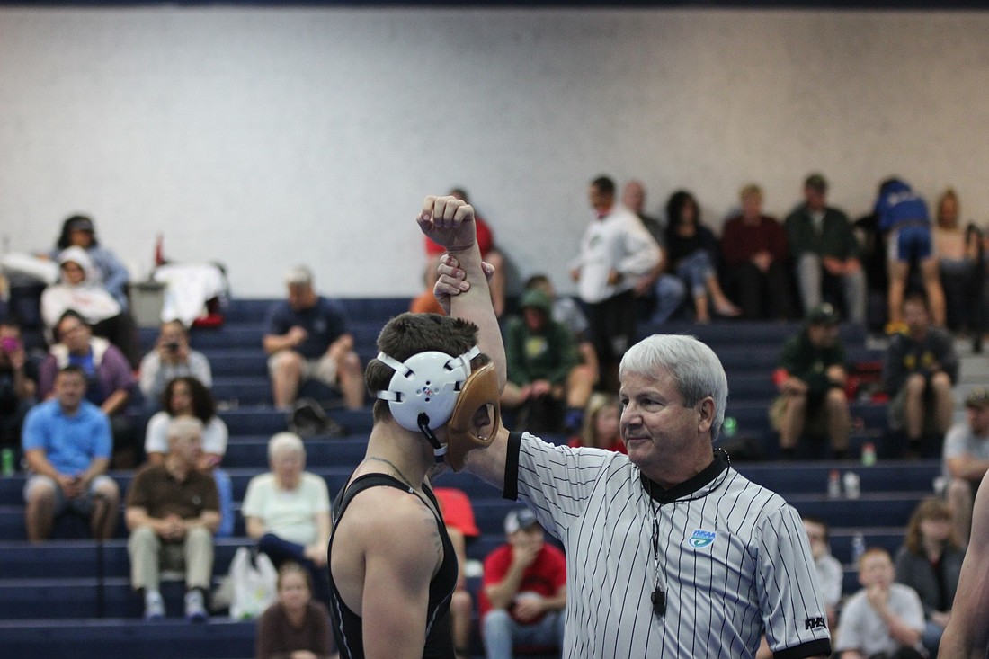 Because of a broken nose, Nieves had to wrestle with a mask.