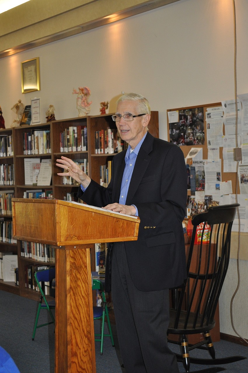 Father Danner begins the meeting.