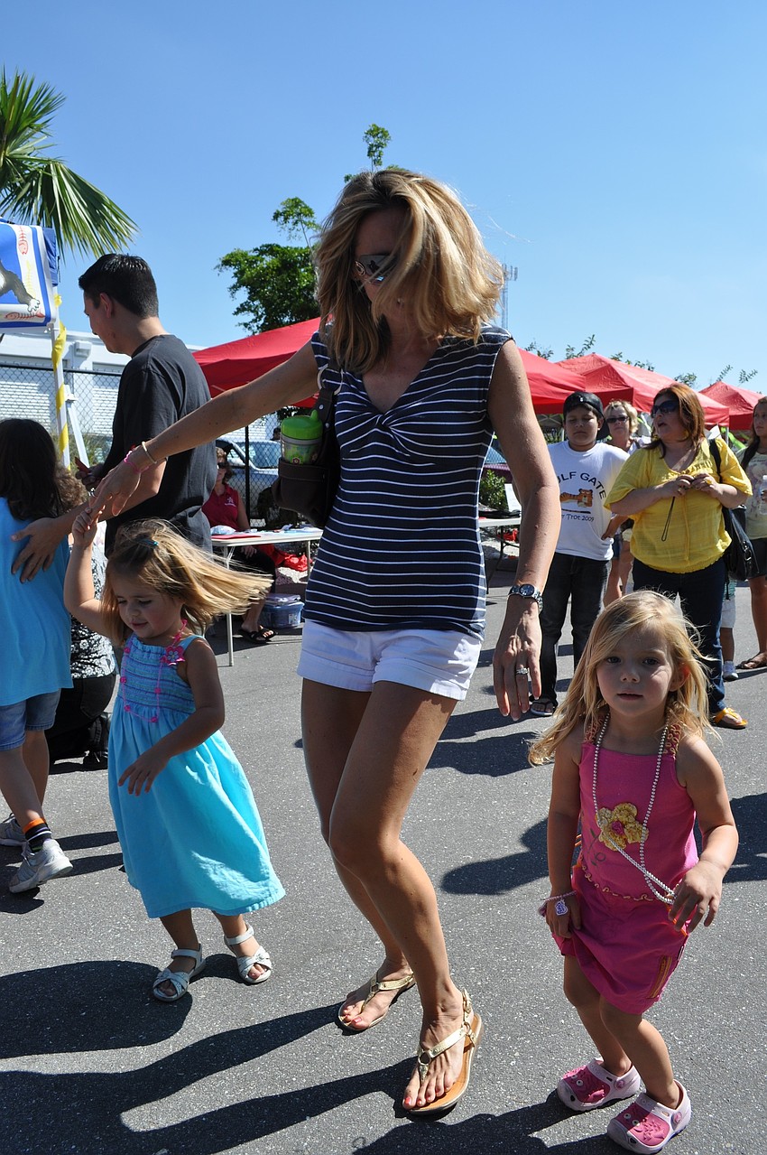 Alex Lee dances with daughter Emilynn, age 3, and Bryce Potter, age 3.