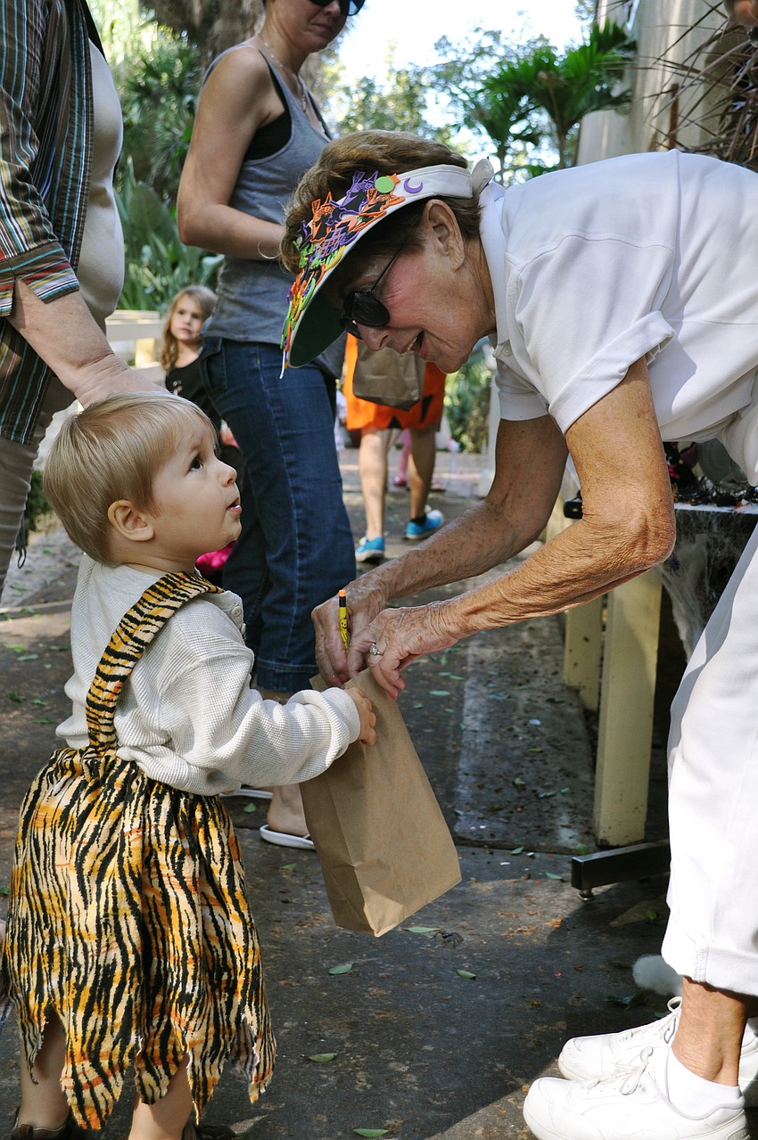 David Morgan IV gets a Halloween treat from Joan Blum.