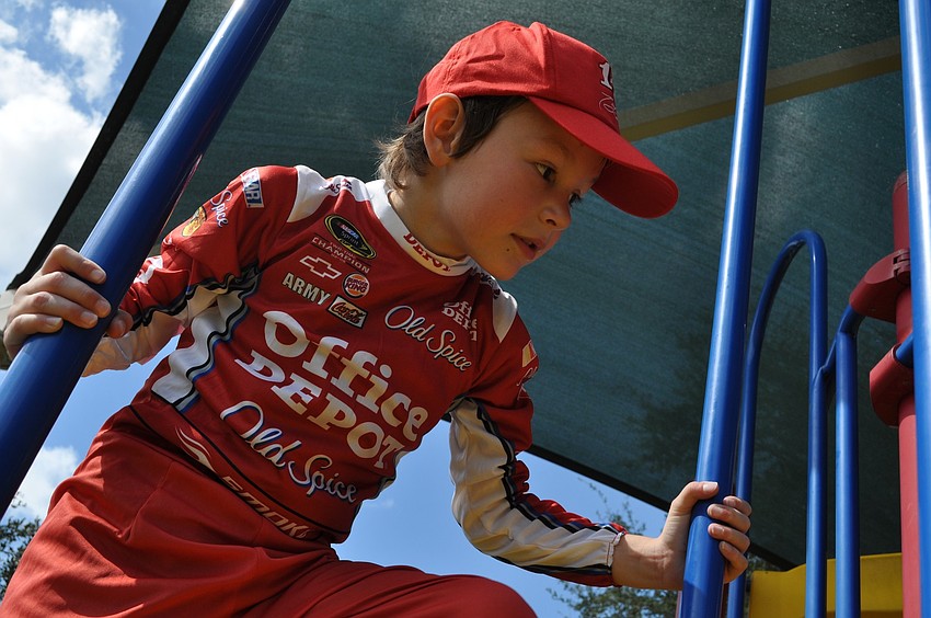 Tyler Akers, 6, was proud of his NASCAR driver costume.