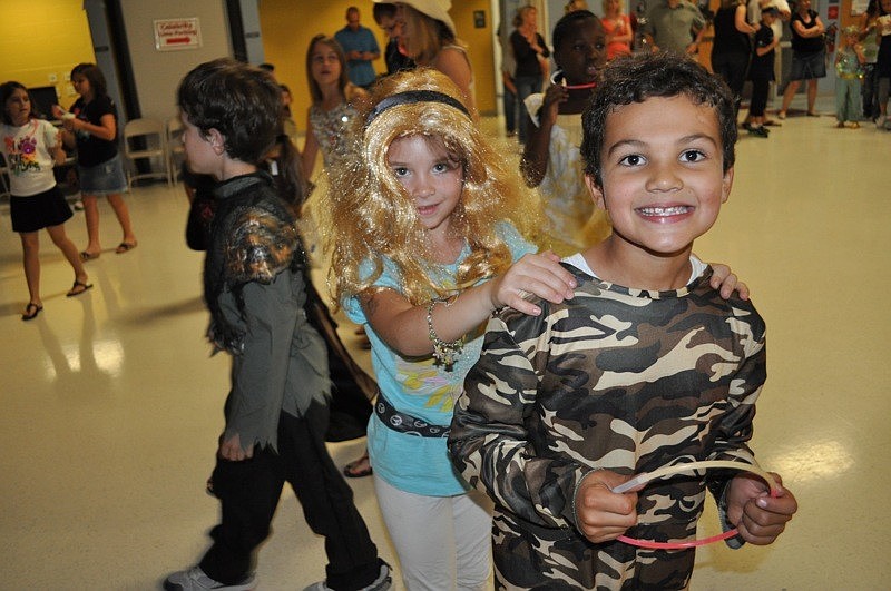 Nolan Carpenter, 7, led Bella Dombroski in a short conga line.