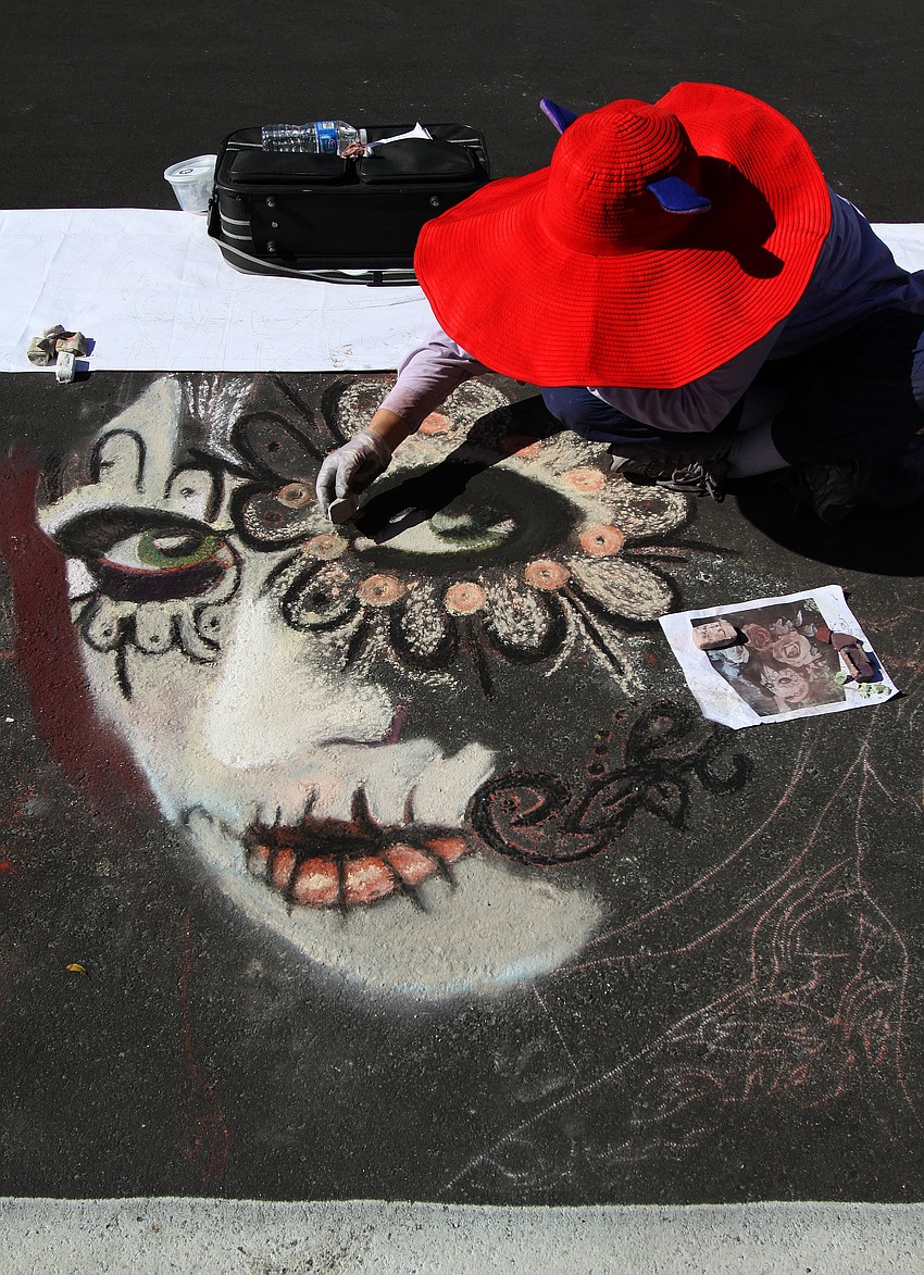 Alice Scott Crittenden, from Santa Barbara, CA., works from a picture taken by John Rees that is from a series called â€œDia de los muertosâ€.