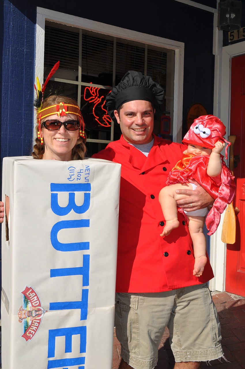 Lobster Pot owners,Fran and Tony Medeiros, dressed up as a stick of butter and a chef with their little lobster, Mikayla.