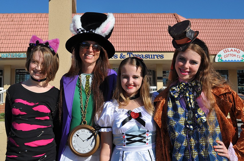 Sarah Robinson, Donna Peregoff, Tory Parris and Allie Campbell as characters from Alice in Wonderland.