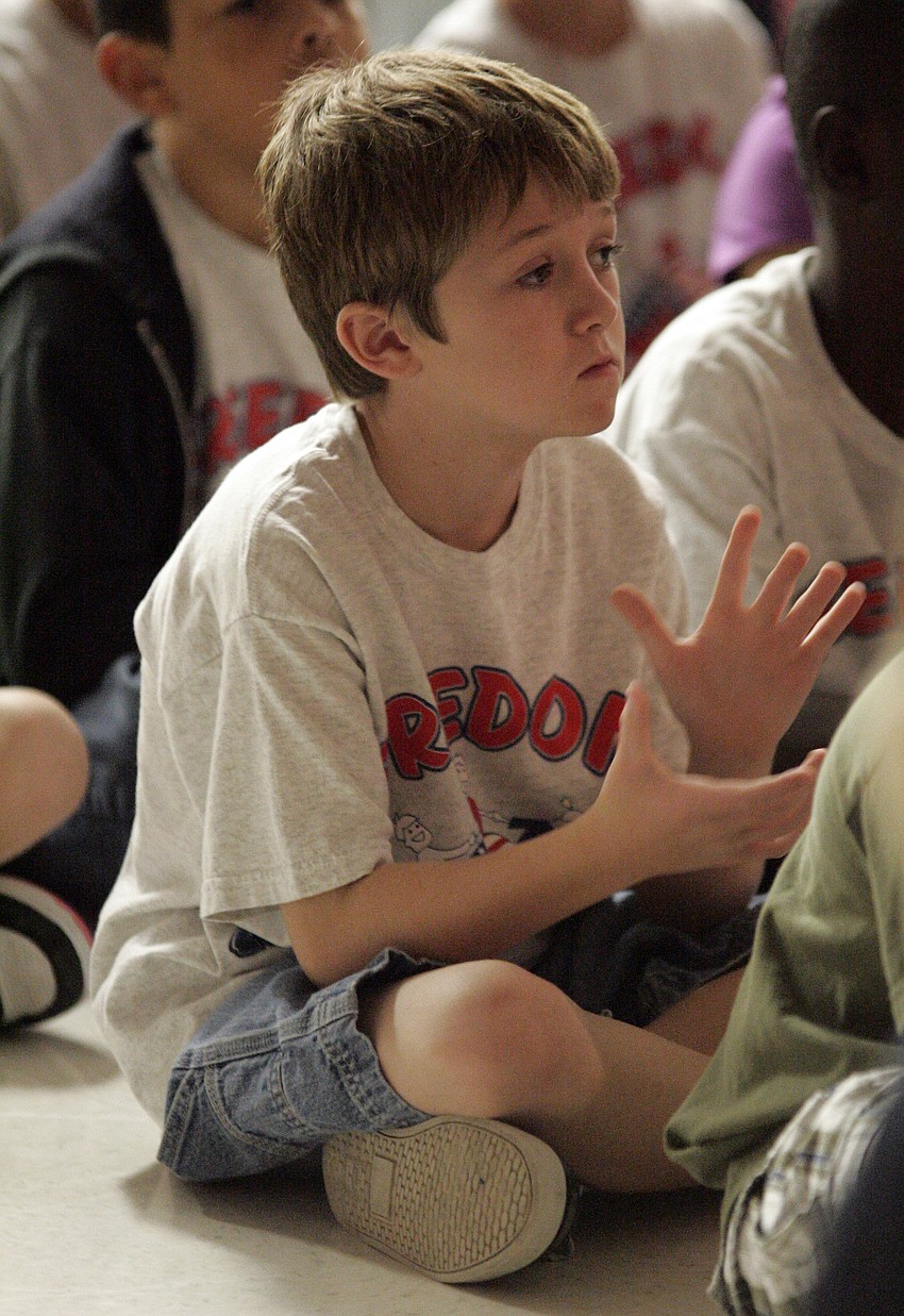 Third-grader Charles Woodward enjoyed learning about the different military flags.