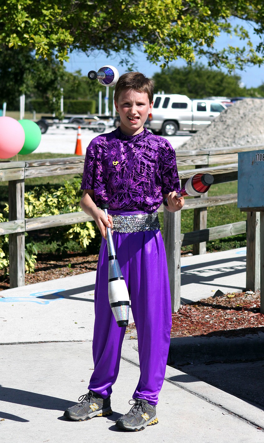 Owen Leonard, 10, juggles out front of the Save Our Seabirds facility. Leonard is a member of the PAL Sailorâ€™s Circus.