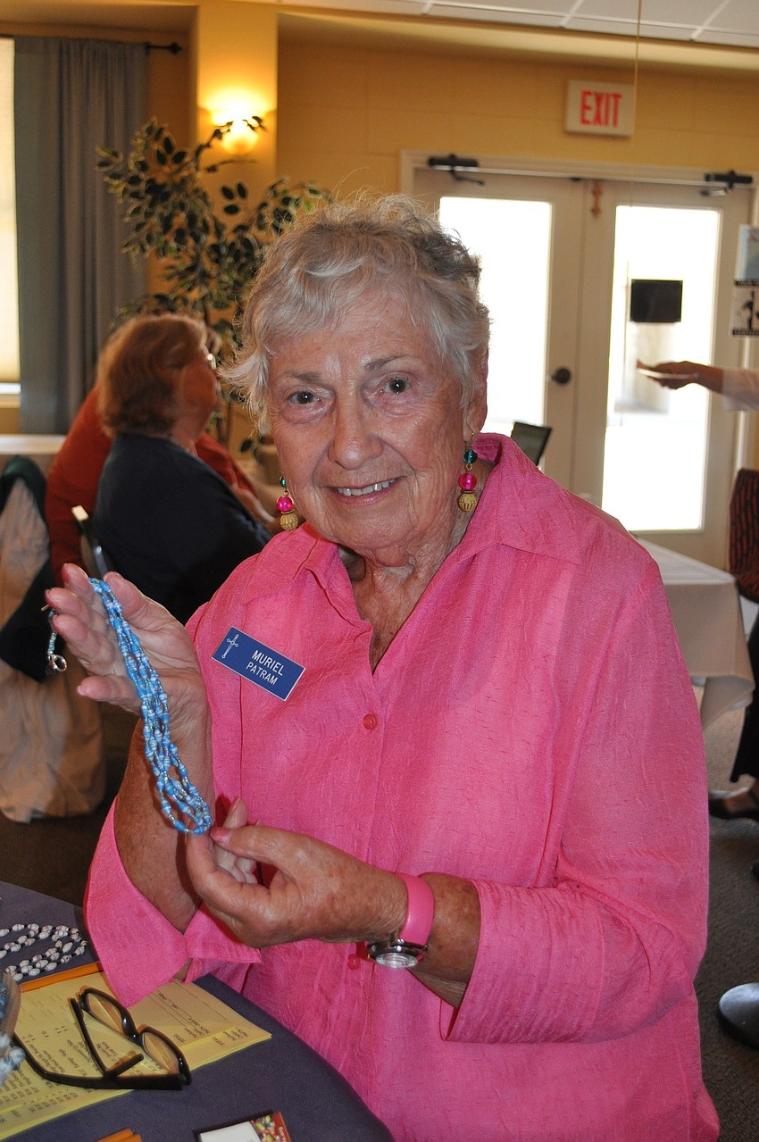 Muriel Patram displays a necklace from BeadforLife.