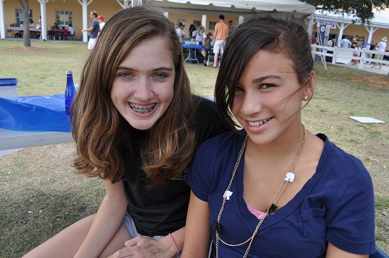 Charlotte Dixon and Miller Condrack helped with a hockey game.