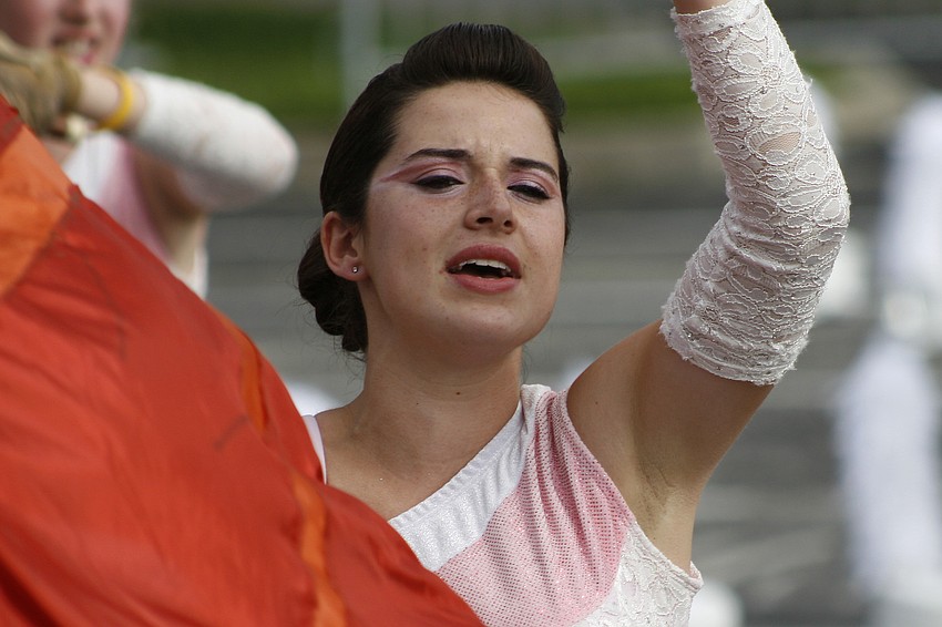 Carly Bayer loves being a part of the color guard.