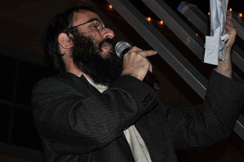 Rabbi Mendy Bukiet helped lead attendees in song during the ceremony.