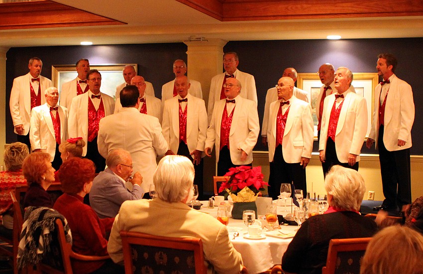 The Sarasota Chorus of the Keys performs during the dessert portion of the evening at the Bird Key Yacht Club on Saturday, Dec. 4.
