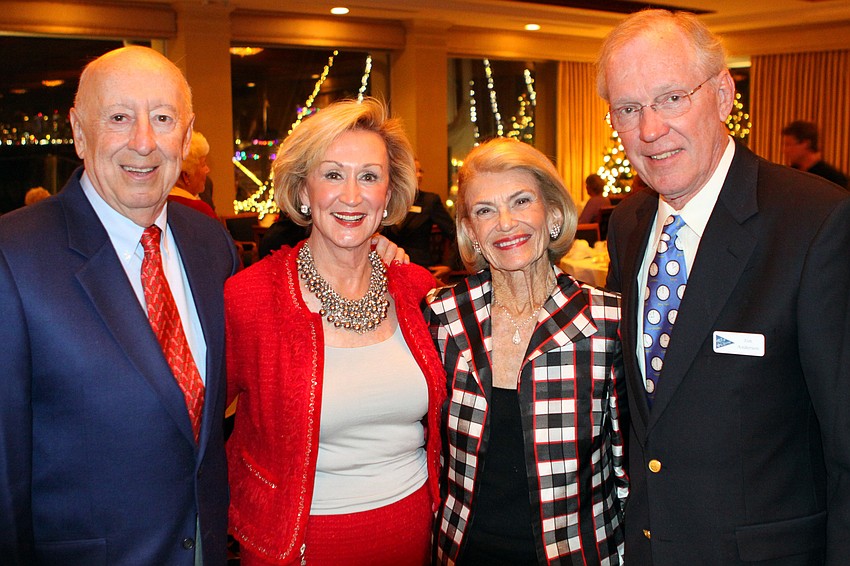 John and Elenor Macheim, Jean DeLynn and Jim Anderson pose together after the Lighting of the Fleet dinner at the Bird Key Yacht Club.