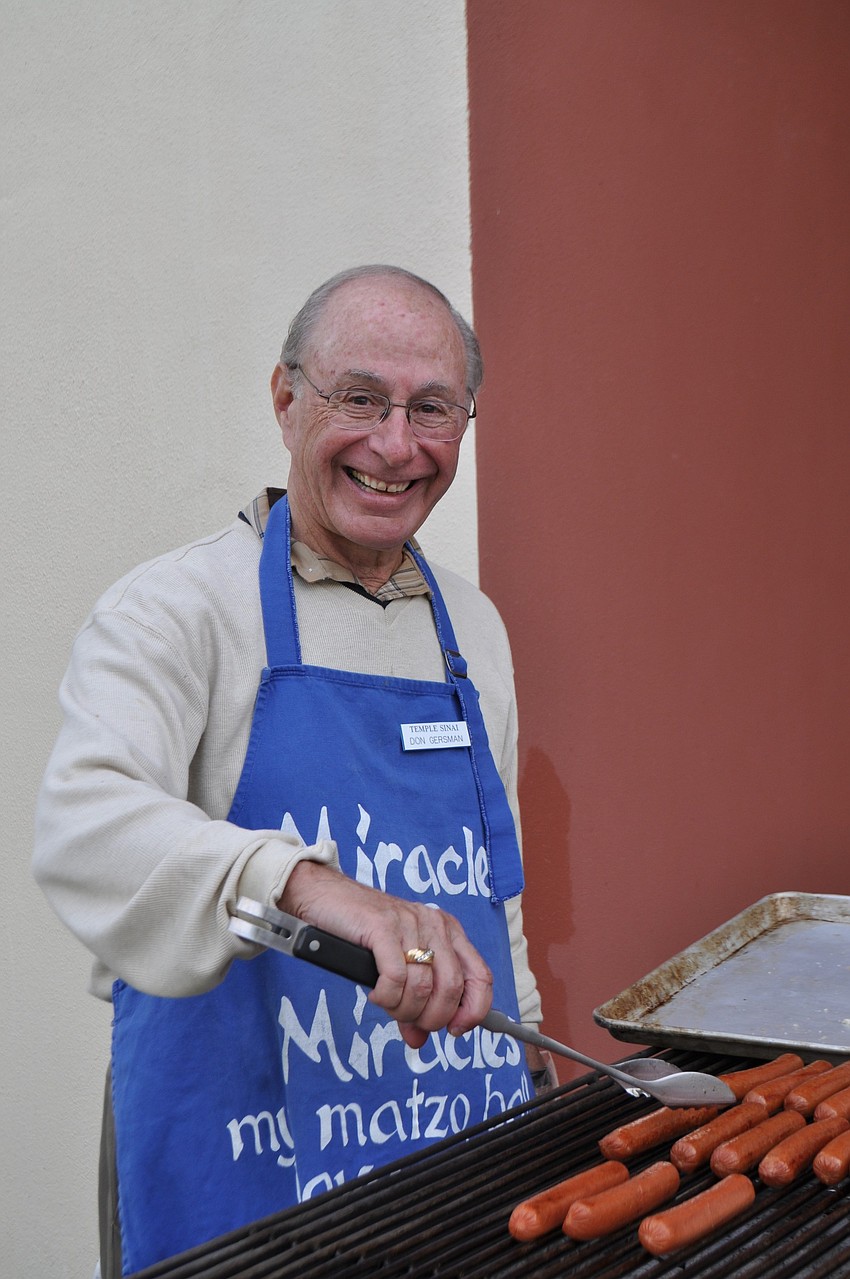 Don Gersman cooks hot dogs.