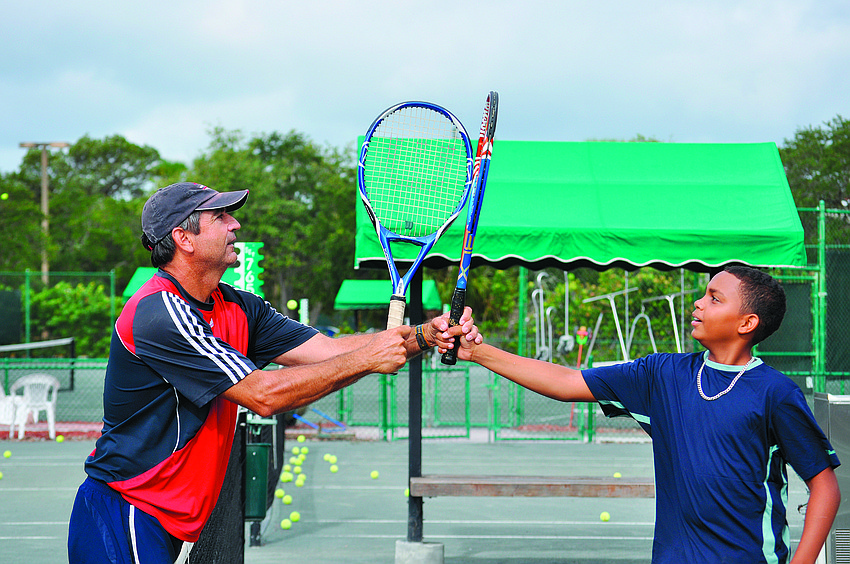 In August, tennis pro Dave Sparks taught Rashard Bull to give a tennis racket high-five.