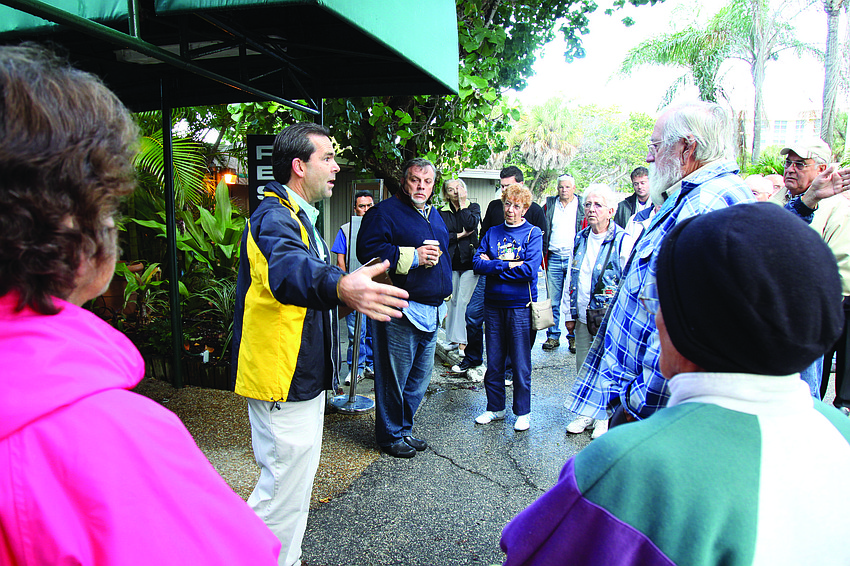 Jim Long explains to the crowd how the liquidation sale and buying process work at the first day of the Colony liquidation sale in December.