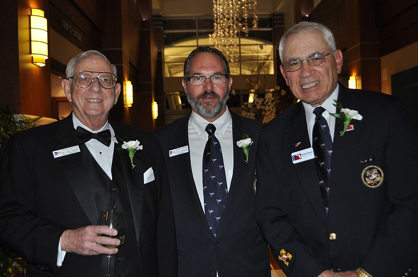 Past Commodore, John Godbold; Commodore Jeff Birnbach; and past Commodore Dick Grovino