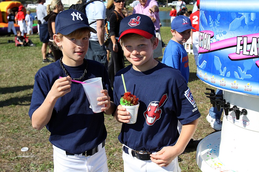 Ryan Blechtat and Max Cohen enjoy some slushies prior to their games on Saturday, Feb. 19 at Twin Lakes Park during Central Sarasota Little League Opening Day.