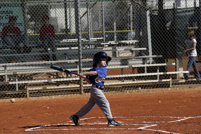 Lakewood Ranch Little League's Hannah Ott, 6, warms up her swing before the start of her exhibition game.