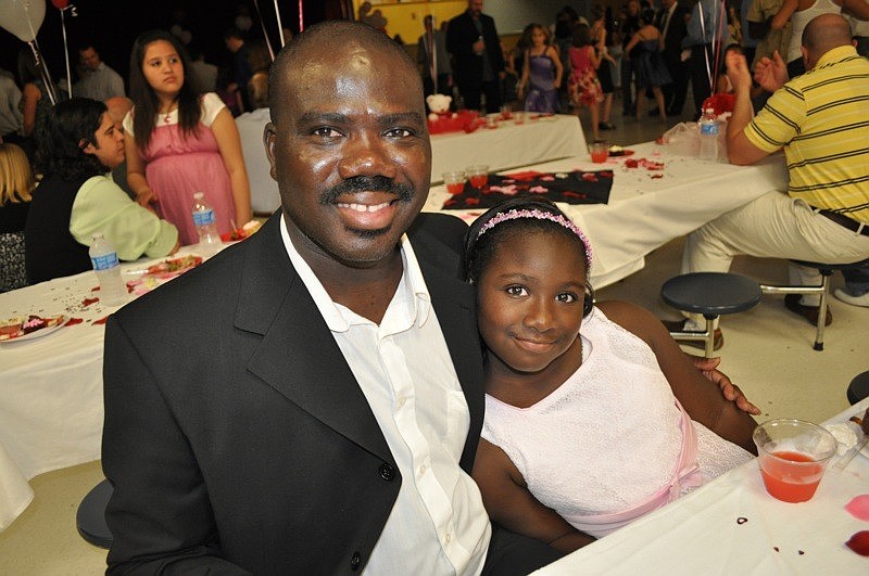 Olurotimi Fakayode and his daughter Ayonna Jackson, 8, feasted on chocolate covered strawberries.