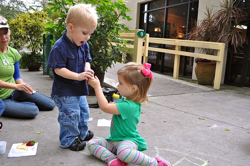 Zane Day and Madison Keel share some grapes.