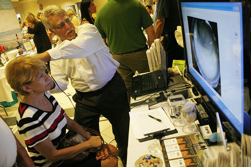 All Ears Hearing Services' Mark Selis used a special score to show attendees the inside of their ears.