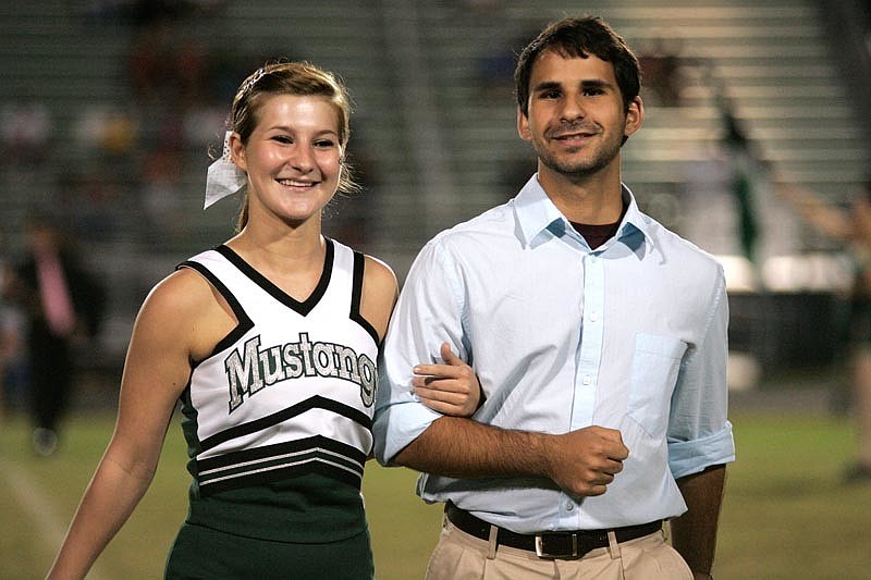 Destiney Williams and Rasheed Waliagha were all smiles as they made their way down the field.
