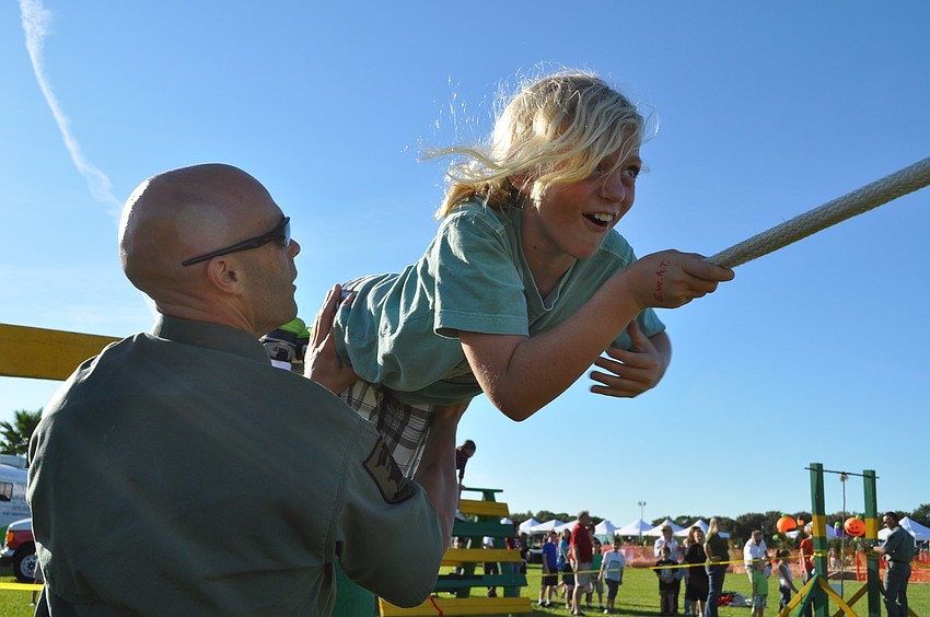 Caroline Birch of Freedom Elementary School braves the ropes portion of the obstacle course.