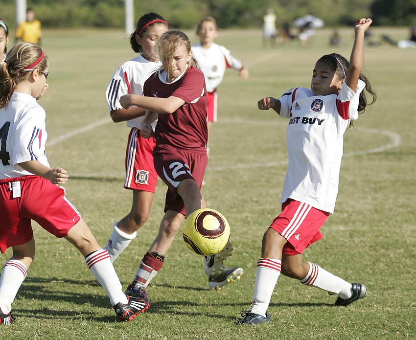 Center midfielder Bree Doeble, 10, goes for the ball against the Chicago Fire.