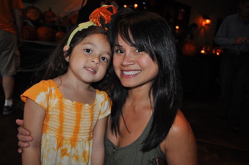 Four-year-old Sophia Cavalluzzi, pictured with her mom Haily, decorated a candied apple for her dad.