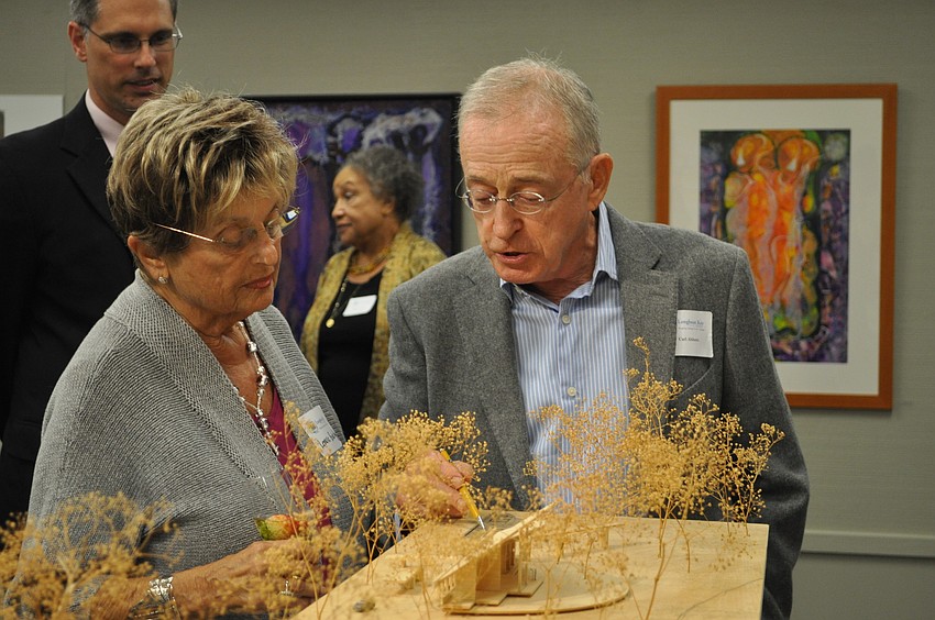 Architect and 2010 Ageless Creativity Award recipient, Carl Abbott, discusses a model of one of his projects with Jean Germain.