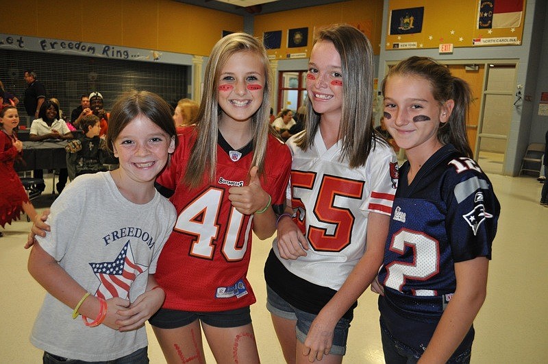 Freedom student Hailee Chapin, 9, brought some sports fans from Haile Middle School â€” Meredith Haas, Samantha Chapin and Brook Bezilla.