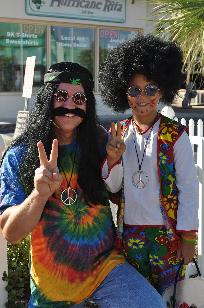 Harald Hvideberg and son, Erik, go as groovy hippies.