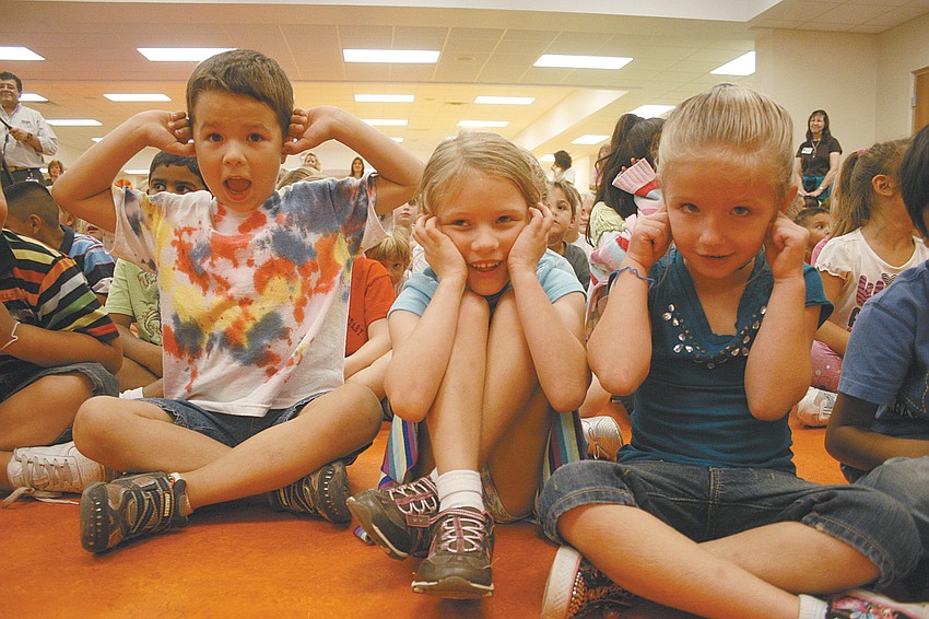 The drumline was a little too loud for Ryan Maurer, Elizabeth Barker and Madleen Kvederis.
