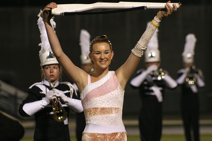 Melissa Hon and the Lakewood color guard add visual effect to the school's show, 