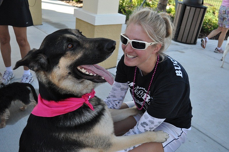 Brittany Carr gets a hug from her dog, Zeus, before the walk.