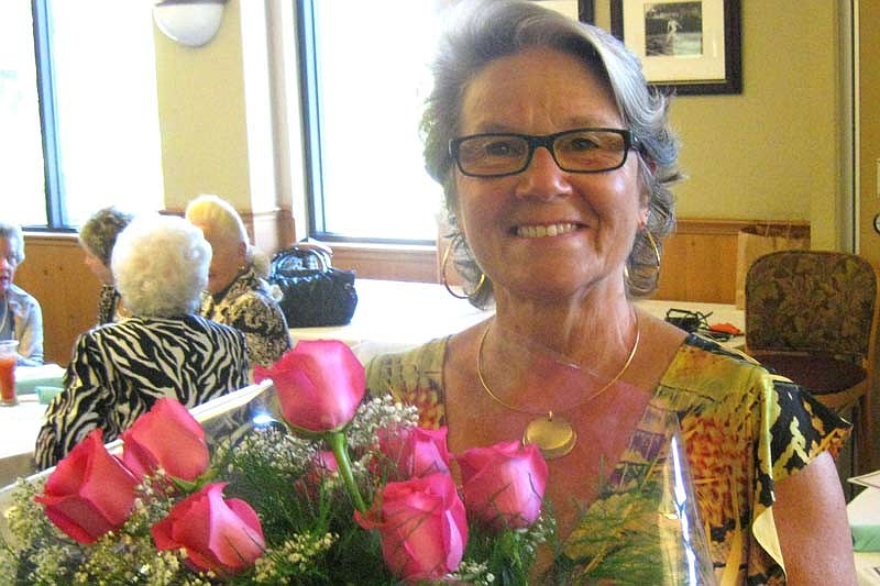 Eloise Eckler loved the roses she won as a door prize.