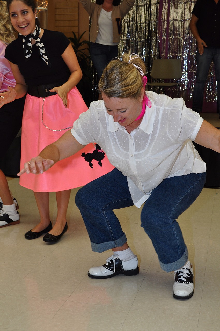 Teacher Rachel DeGarmo twists for the students.