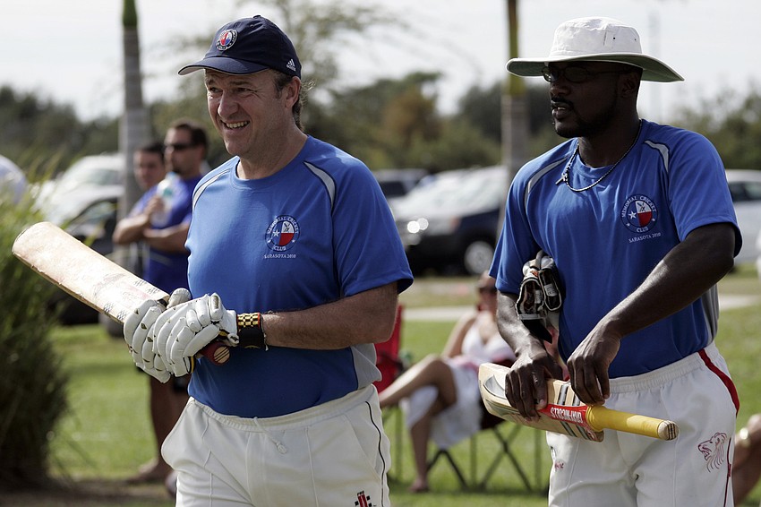 Batsmen Dave Boynton and Owen Brown take the field for their game.