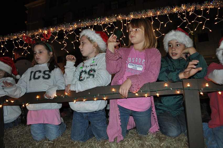 Students from Incarnation Catholic School wave to the crowd.