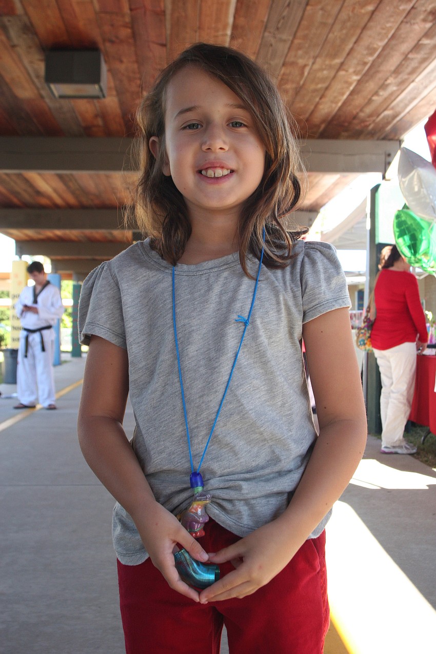 Nine-year-old Grace Shigley enjoyed making a sand art necklace.