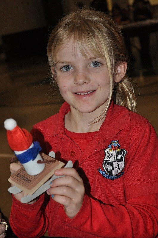 Kristyn Collins, 6, made a skiing marshmallow snowman ornament.