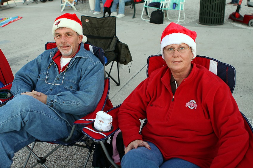 Marty and Jody Kyle sit in their chairs as they wait for the boat parade to begin.