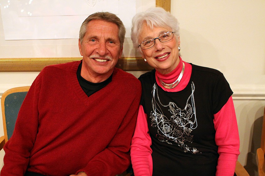 Don Cooks and Jo Zentz sit near one another at the holiday party at Seaplace.