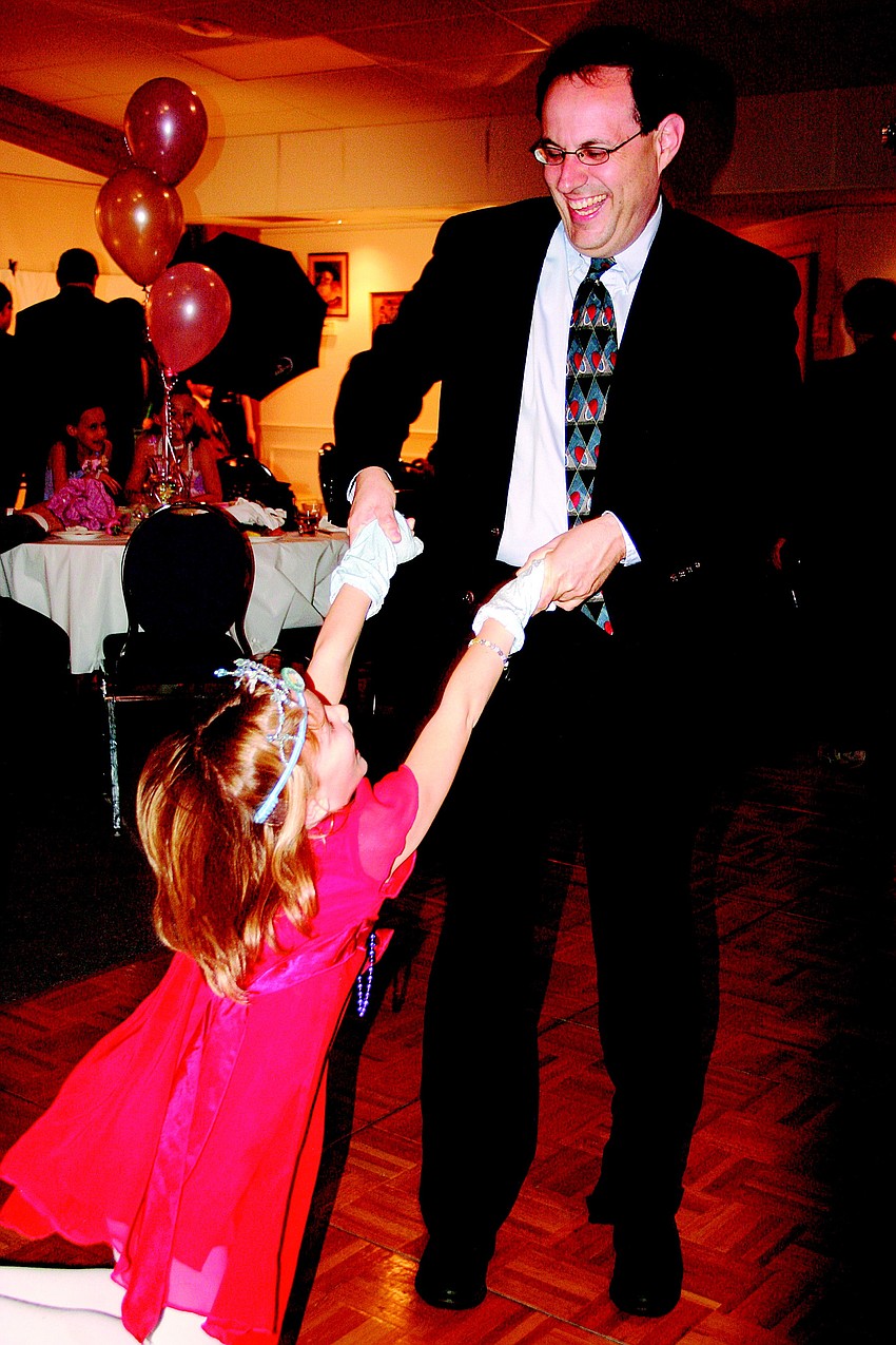 Uzi and Miriam Baram dance together in January at Temple Emanu-El's father-daughter dance.
