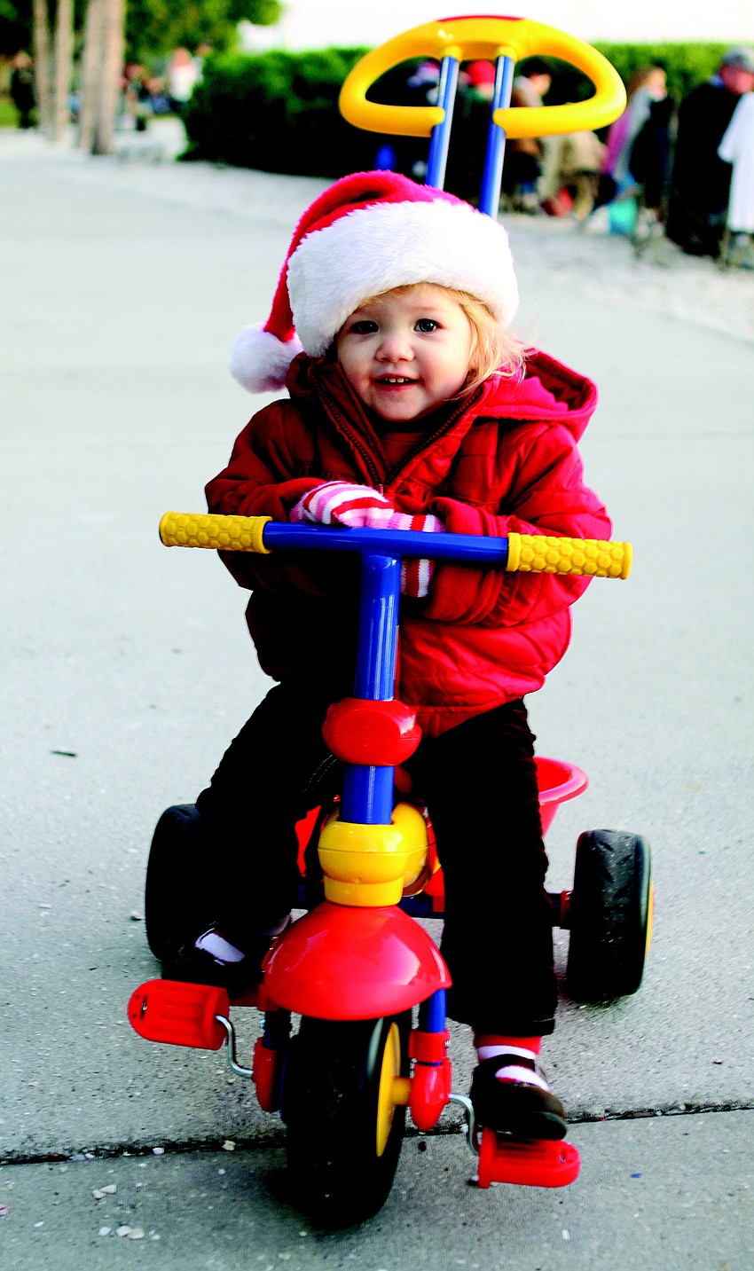Addison Hartley took a spin on her bike at the 24th annual Sarasota Holiday Boat Parade of Lights in December.